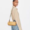 T Monogram Pebbled Cylinder Bag